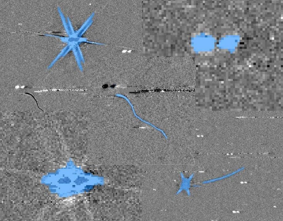 Exemplos de como os artefatos podem se parecer em dados de telescópios espaciais. As áreas em azul indicam pixels que o modelo de IA considera inválidos. Os voluntários do Artifact InSPECtor aprenderão a verificar se a máquina acertou.