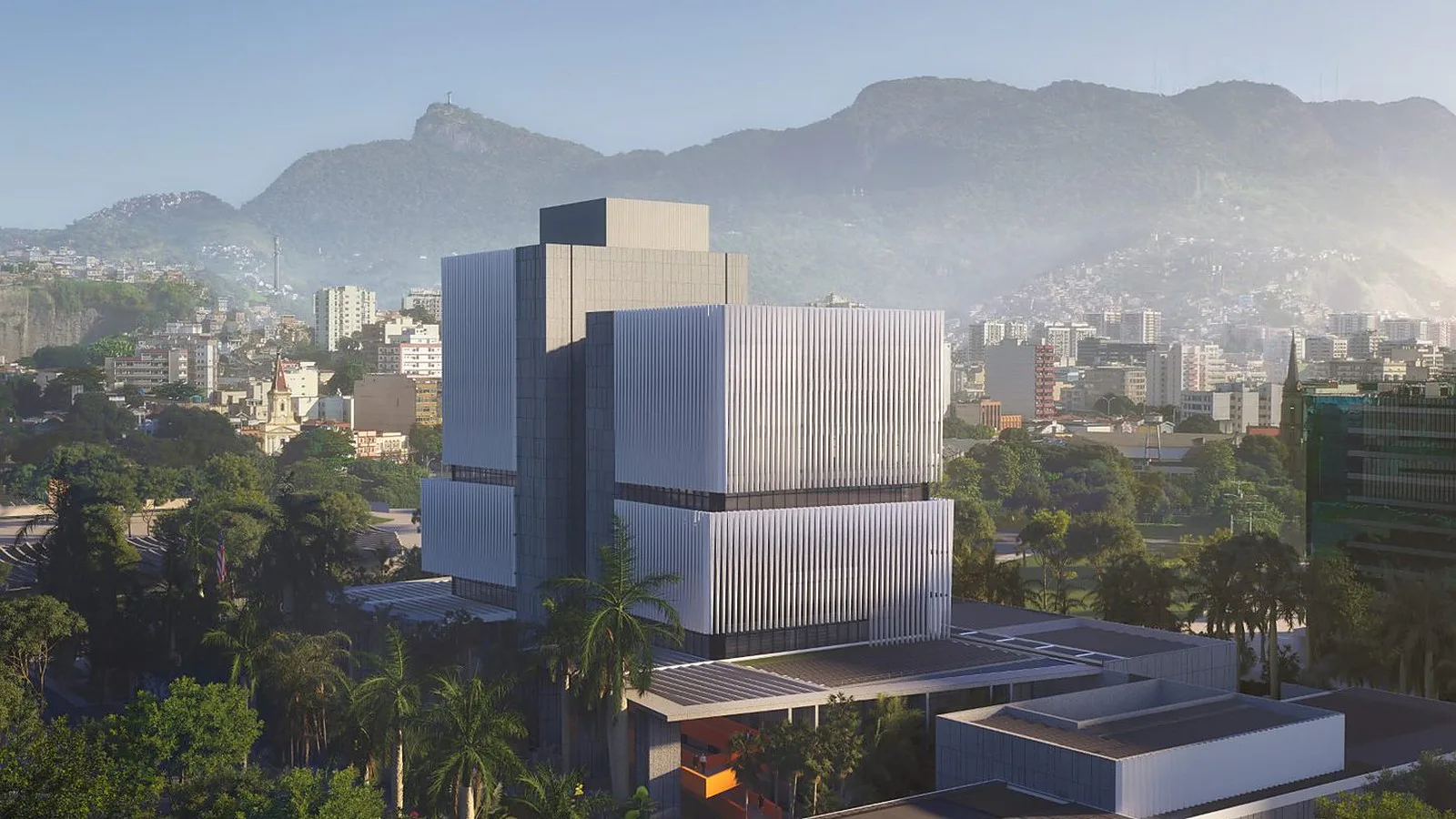 Projeção aérea do novo consulado na Cidade Nova, com prédios do centro do Rio e o morro do Corcovado ao fundo
