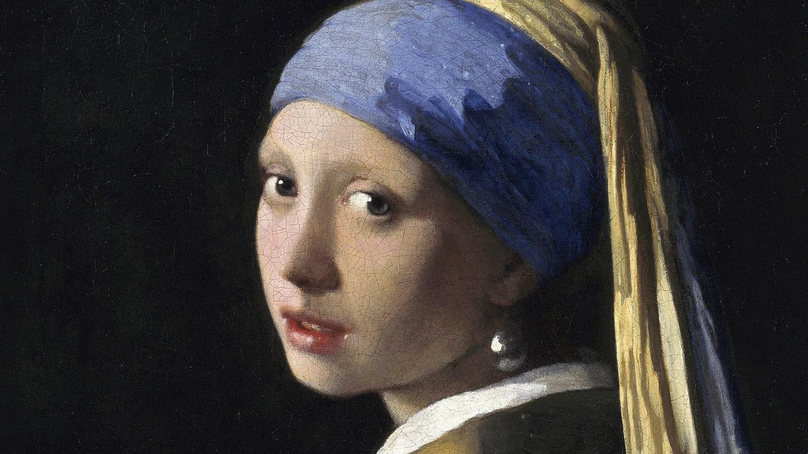 Detalhe de Moça com Brinco de Pérola, de Johannes Vermeer: a jovem de turbante azul olha por cima do ombro, com a pérola na orelha