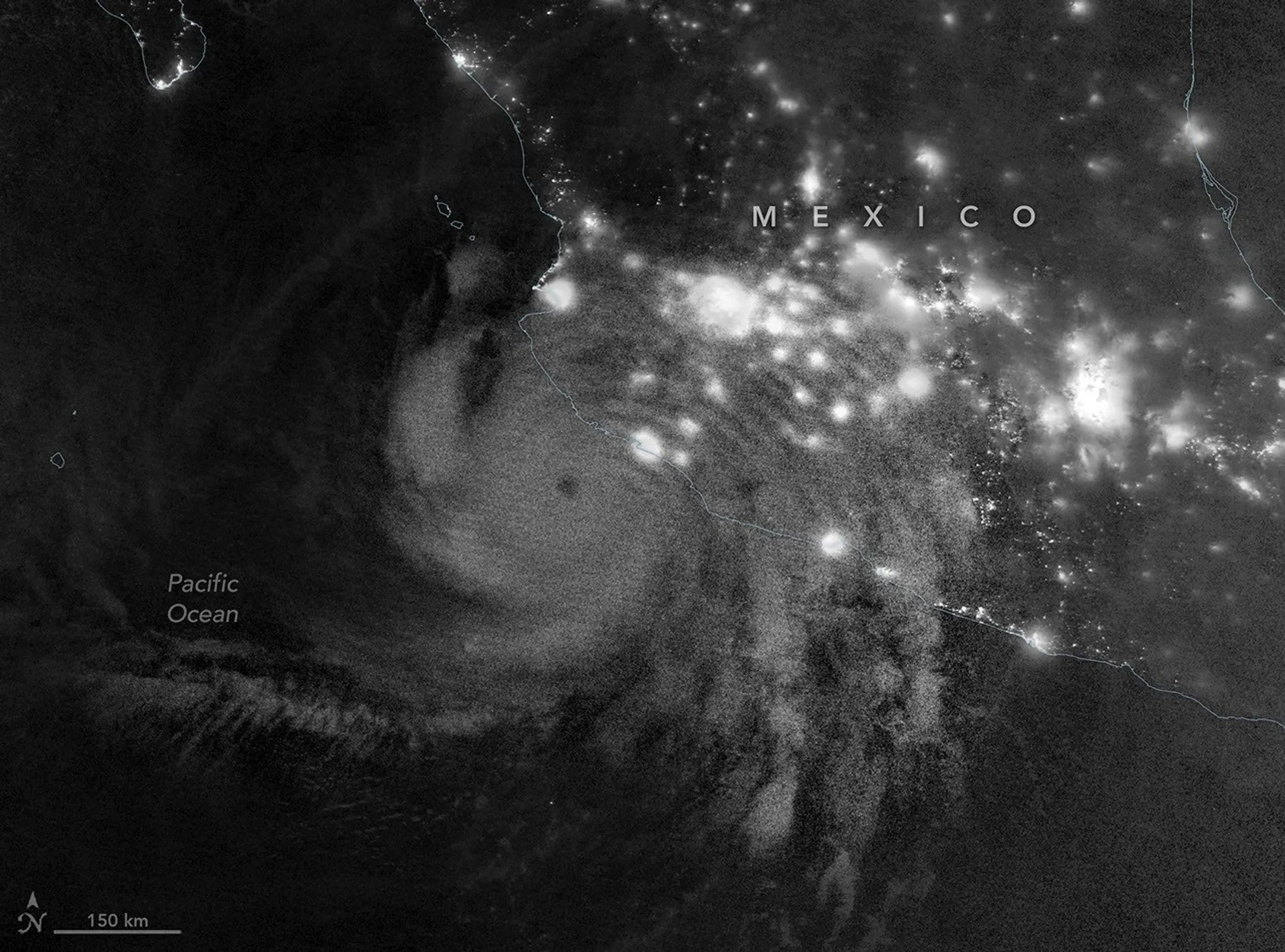 Ondas de gravidade atmosféricas geradas pelo furacão Simon são visíveis por meio do brilho noturno mesosférico (airglow) nesta imagem noturna obtida com o VIIRS (Visible Infrared Imaging Radiometer Suite) a bordo do satélite NOAA-21 em 11 de outubro de 2026.