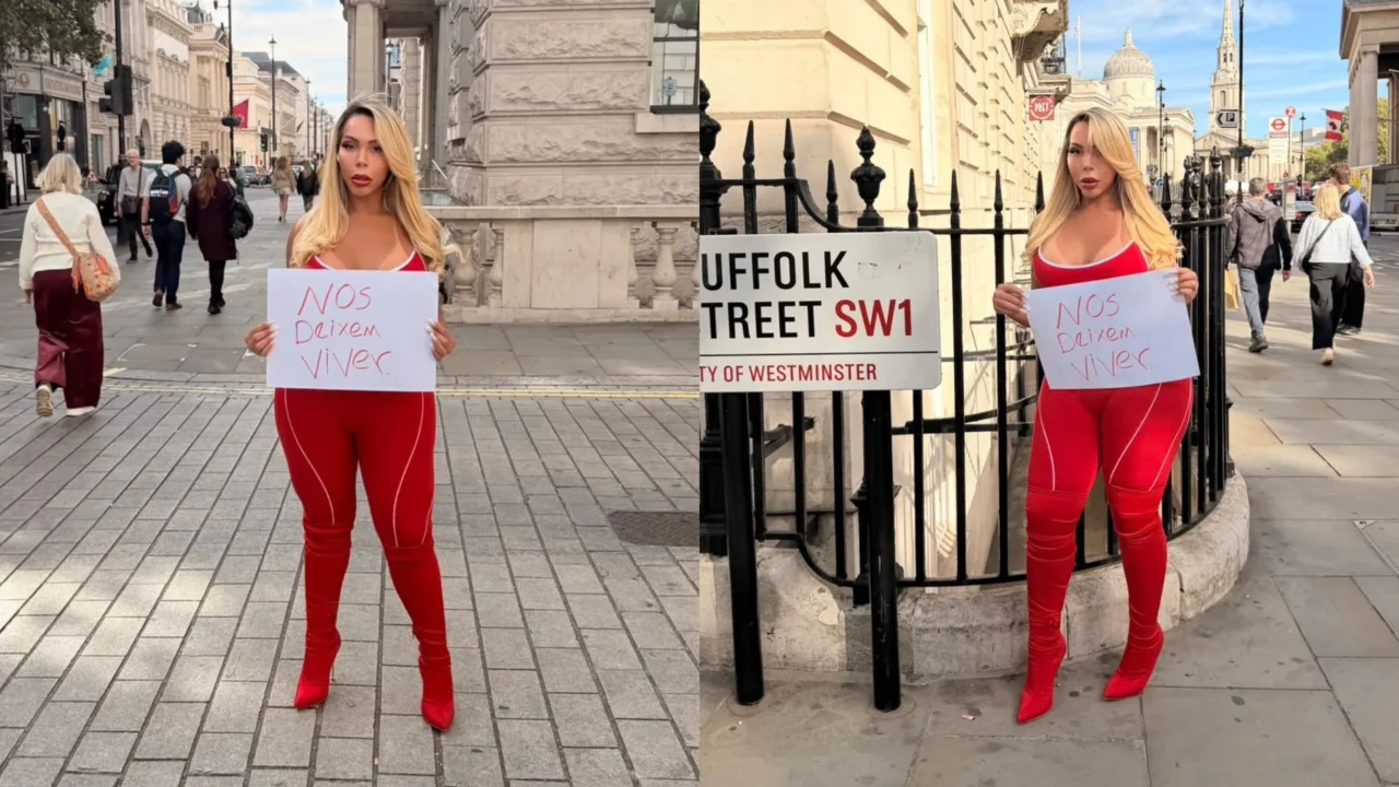 A influenciadora trans brasileira Suellen Carey segura cartaz com a frase 'Nos deixem viver' na rua Suffolk Street, em Londres, neste domingo (4). Refugiada no Reino Unido, ela escolheu o dia da eleição brasileira para protestar em defesa da população trans, enquanto brasileiros que vivem no exterio